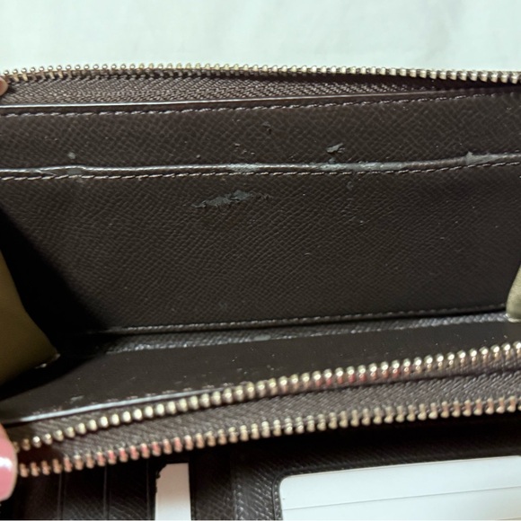 Coach Tan and Brown Signature Wristlet with defects. - Picture 4 of 5